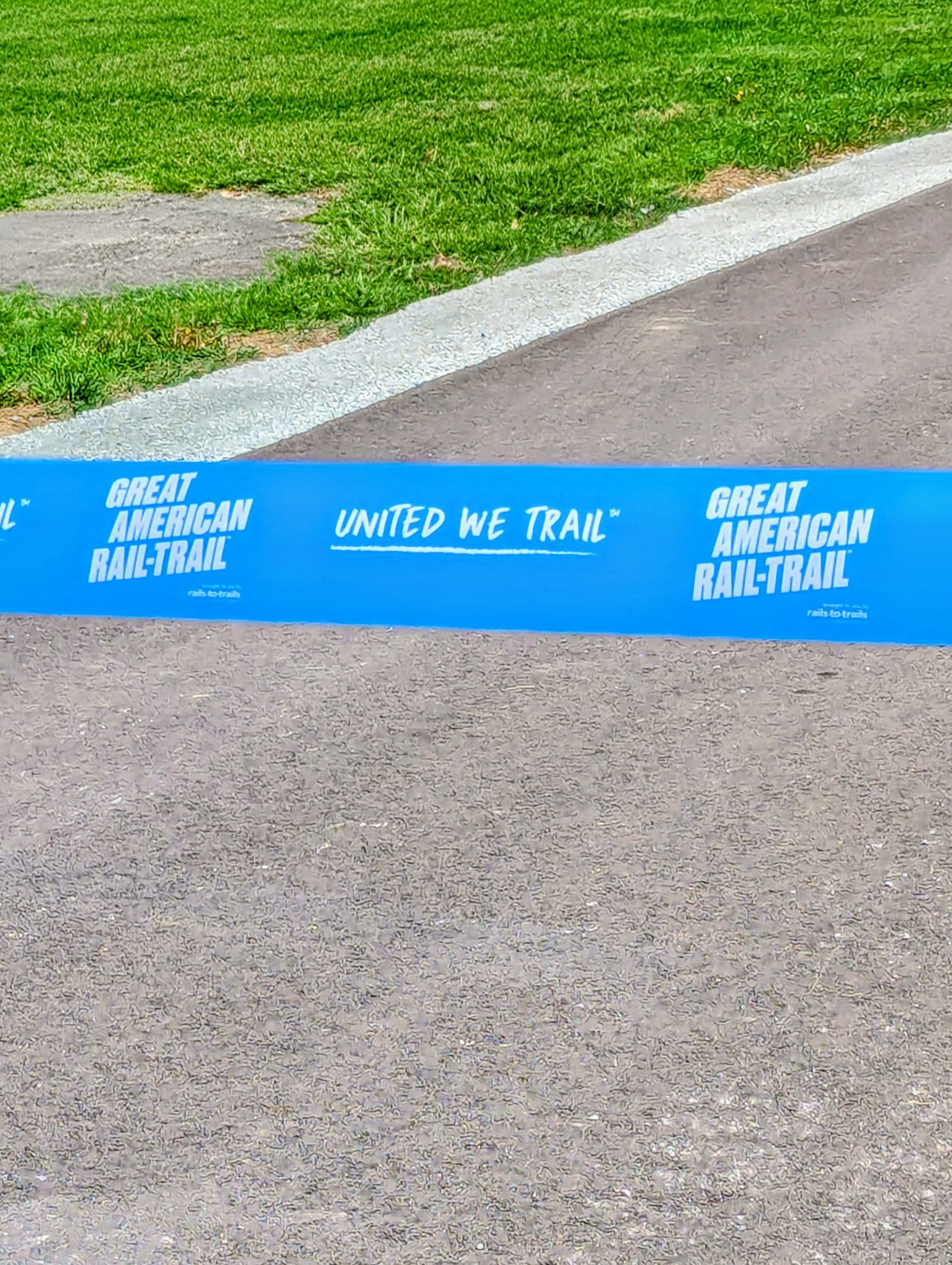 Great American Rail-Trail ribbon stretched across the MAC Trail at the grand opening